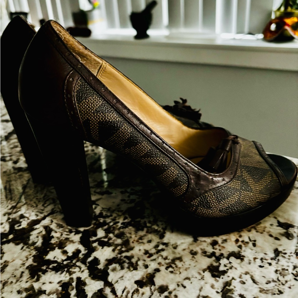 Michael Kori’s signature brown pumps